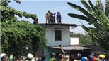 Thanh niên nghi ngáo đá cầm gạch đe dọa, cố thủ trên mái nhà 